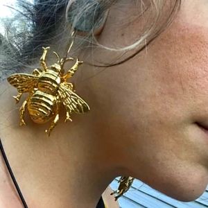 Gold tone chunky bug earrings